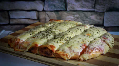 Porción de pizza muzzarella